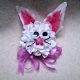 bunny corsage made with artificial flowers.