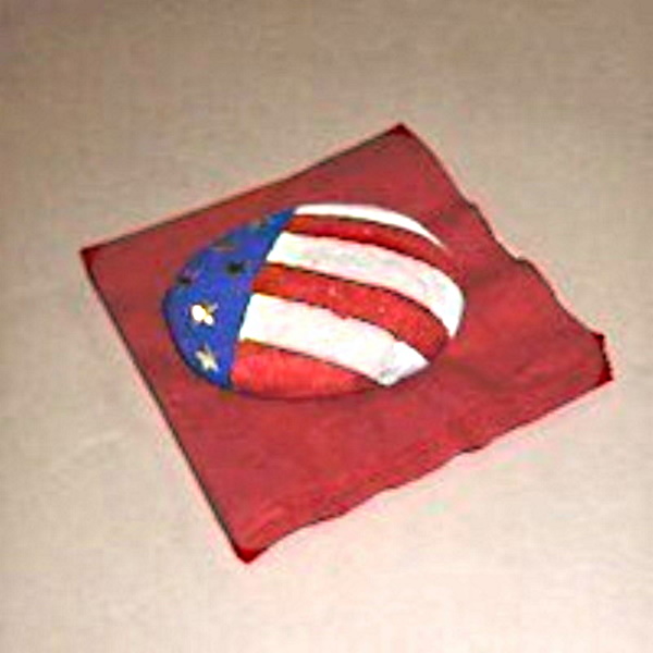 Rock painted red, white and blue to hold napkins down.