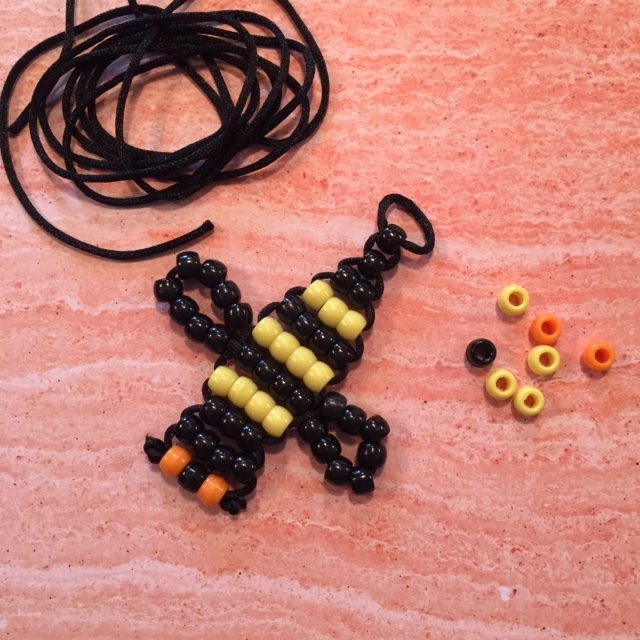 Bee made from black and yellow pony beads.