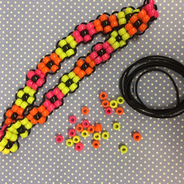 Headband made with colorful pony beads in the shape of flowers