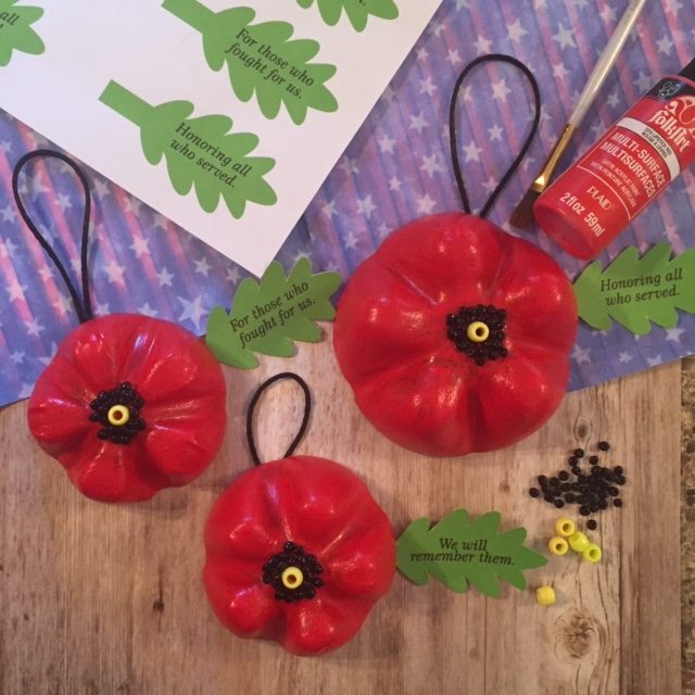 Recycle plastic bottles made into poppy door hangers for veterans