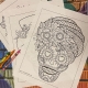 Coloring pages for older children featuring sugar skulls.