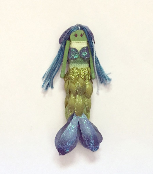 Mermaid doll made from clothespins and flower petals.