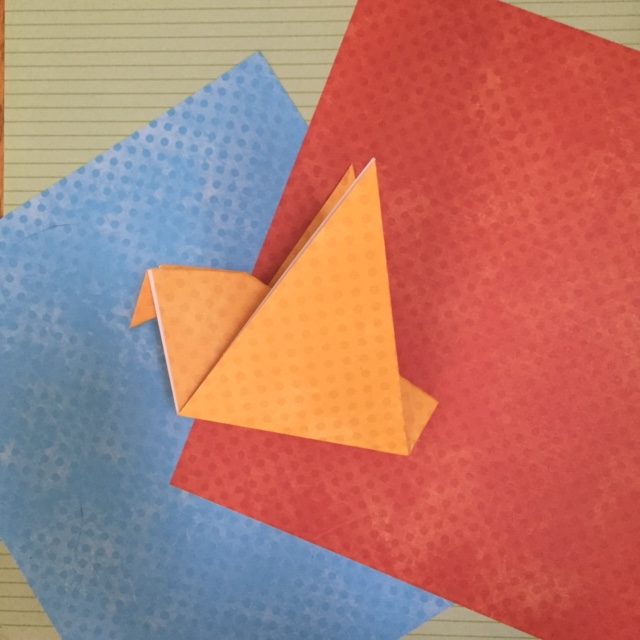 Paper folding to make and easy origami bird.