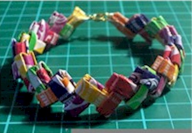 folded gum or candy wrappers made into a bracelet