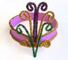 Mardi Gras headpiece made with purple, green and gold pipe cleaners.